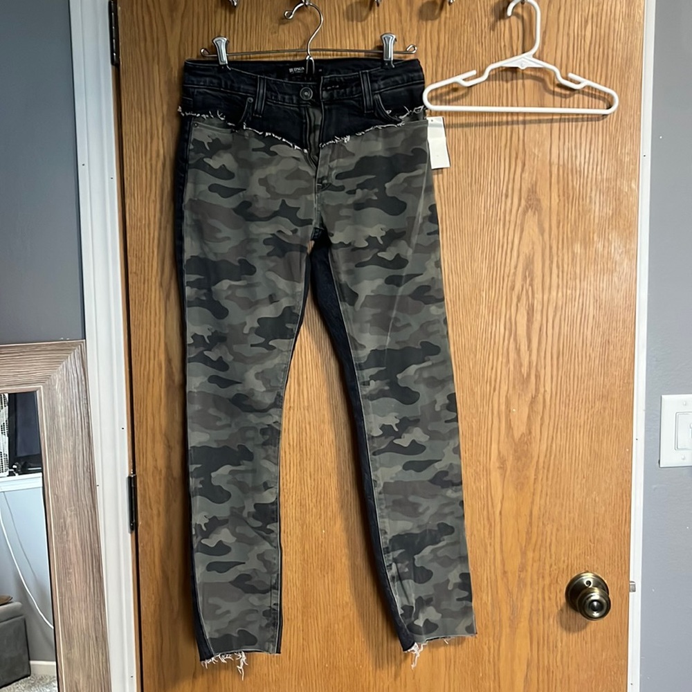 Black jeans with green camo pattern